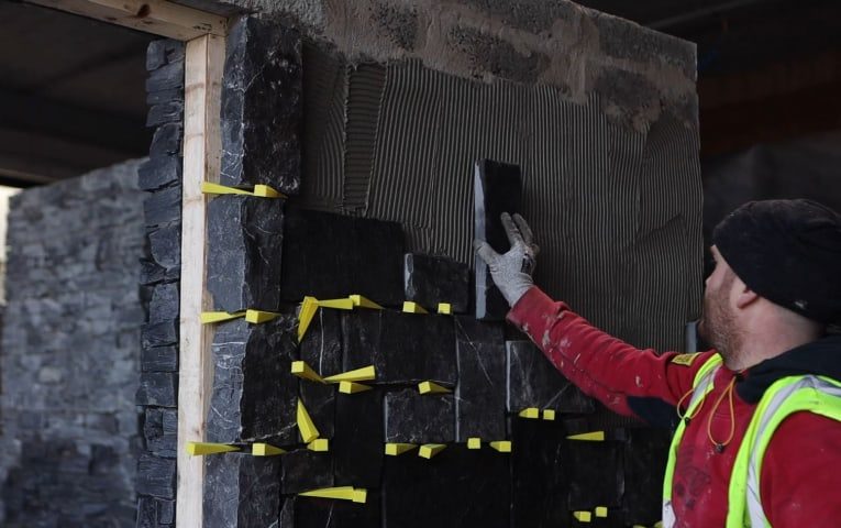 Stone veneer fitting guide cover